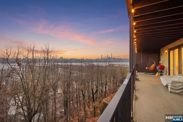 a view of a balcony with lake view and mountain view
