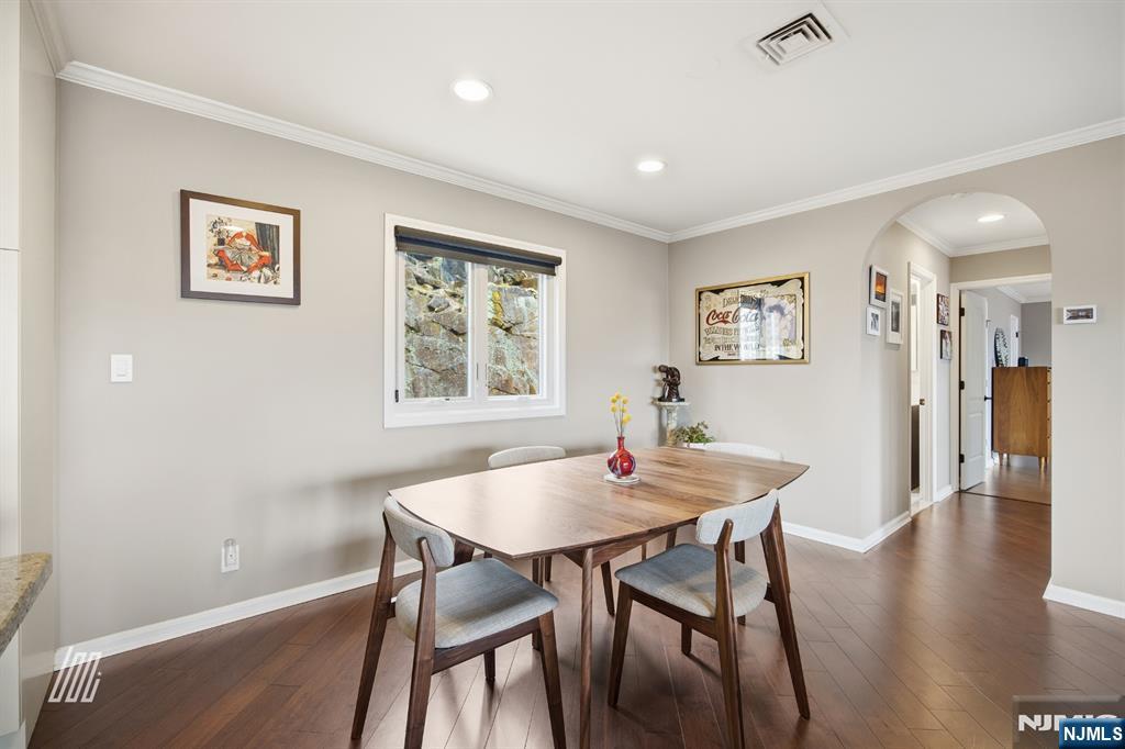 300 Gorge Road, Unit 75 Cliffside Park, NJ 07010 - Photo 12 of 27 a view of a dining room with furniture and wooden floor