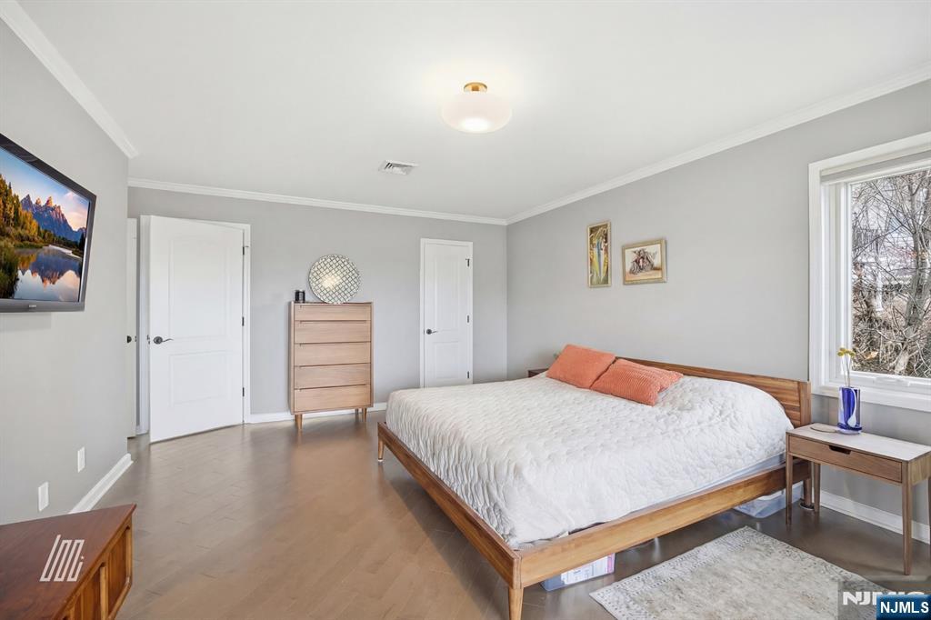 300 Gorge Road, Unit 75 Cliffside Park, NJ 07010 - Photo 16 of 27 a bedroom with a bed and a flat screen tv