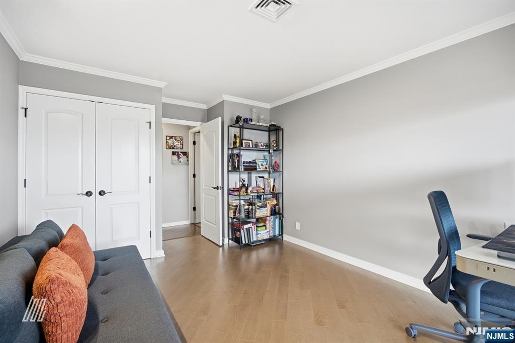 300 Gorge Road, Unit 75 Cliffside Park, NJ 07010 - Photo 20 of 27 a view of a livingroom with furniture and a wooden floor