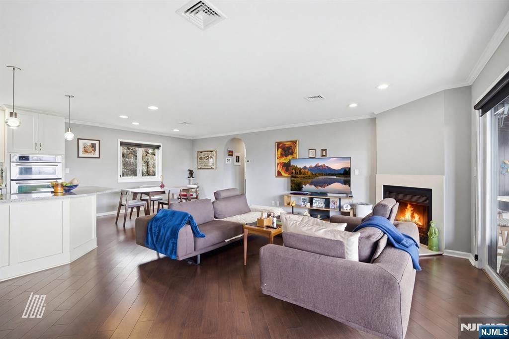 300 Gorge Road, Unit 75 Cliffside Park, NJ 07010 - Photo 3 of 27 a living room with fireplace furniture and a wooden floor