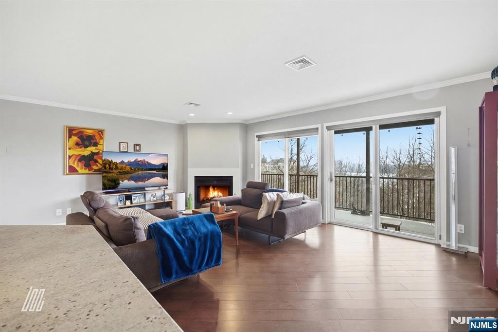 300 Gorge Road, Unit 75 Cliffside Park, NJ 07010 - Photo 4 of 27 a living room with furniture large window and a fireplace