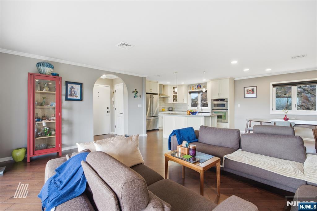 300 Gorge Road, Unit 75 Cliffside Park, NJ 07010 - Photo 6 of 27 a living room with furniture and a wooden floor