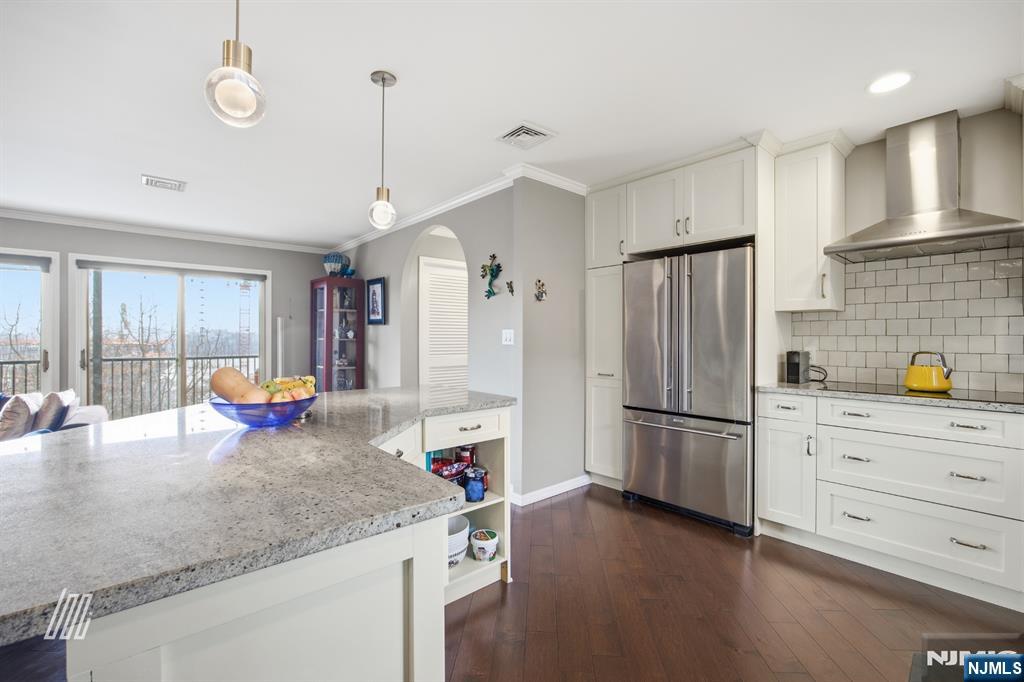 300 Gorge Road, Unit 75 Cliffside Park, NJ 07010 - Photo 9 of 27 a kitchen with refrigerator and cabinets
