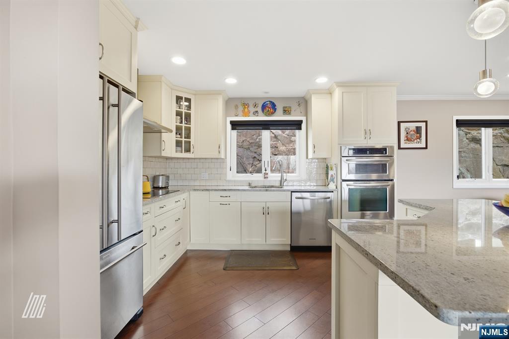 300 Gorge Road, Unit 75 Cliffside Park, NJ 07010 - Photo 10 of 27 a kitchen with a refrigerator sink and stove