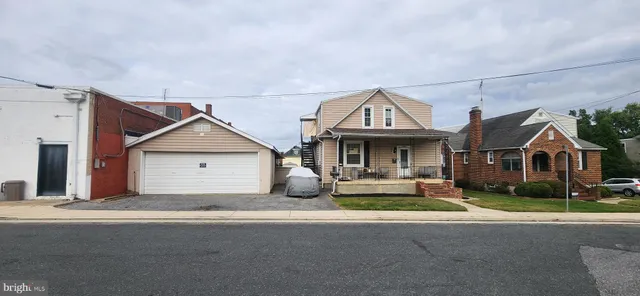 a front view of a house with yard