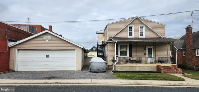 a front view of a house with garage