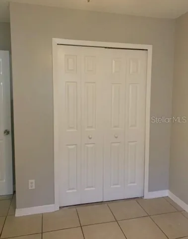 a view of an empty room and a window