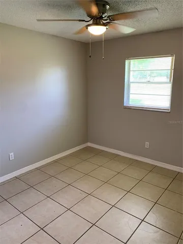 a view of a room with cabinet and mirror