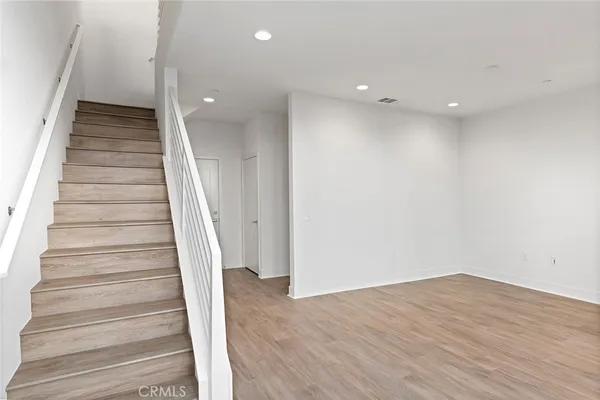 a view of entryway with wooden floor