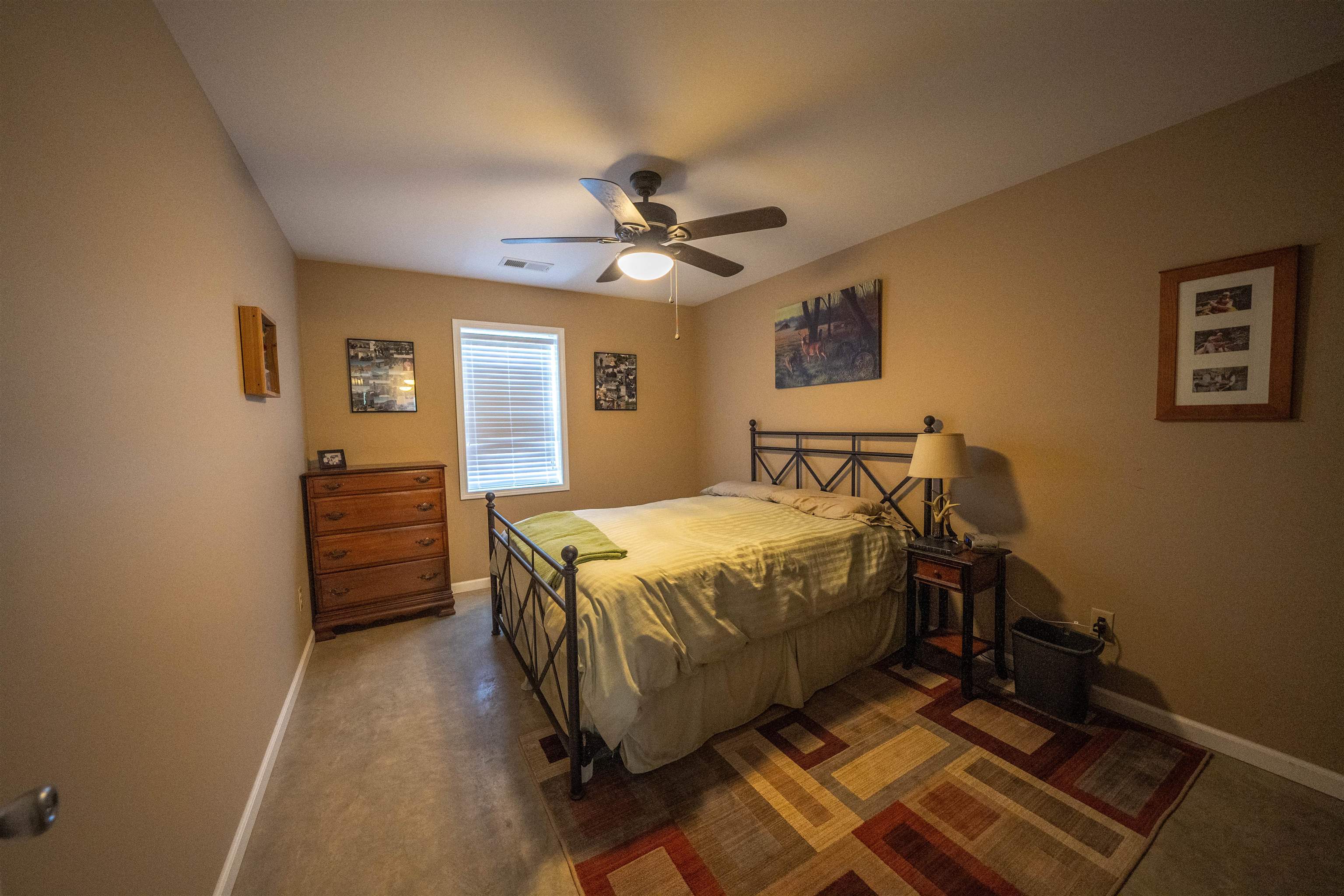 1485 Walton Road Bolivar, TN 38008 - Photo 11 of 23 a bedroom with a bed and a ceiling fan