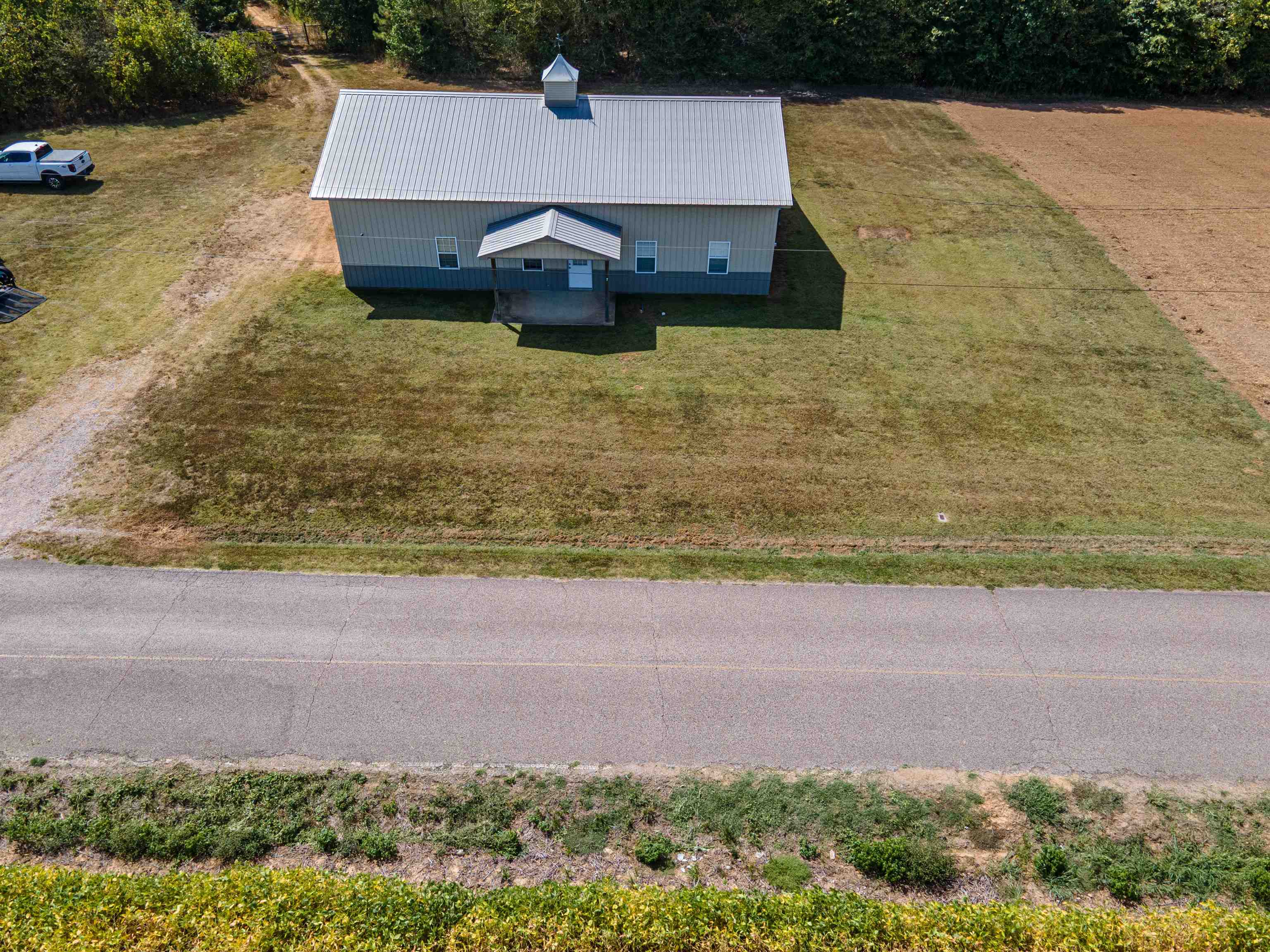 1485 Walton Road Bolivar, TN 38008 - Photo 2 of 23 a view of a backyard with lawn chairs