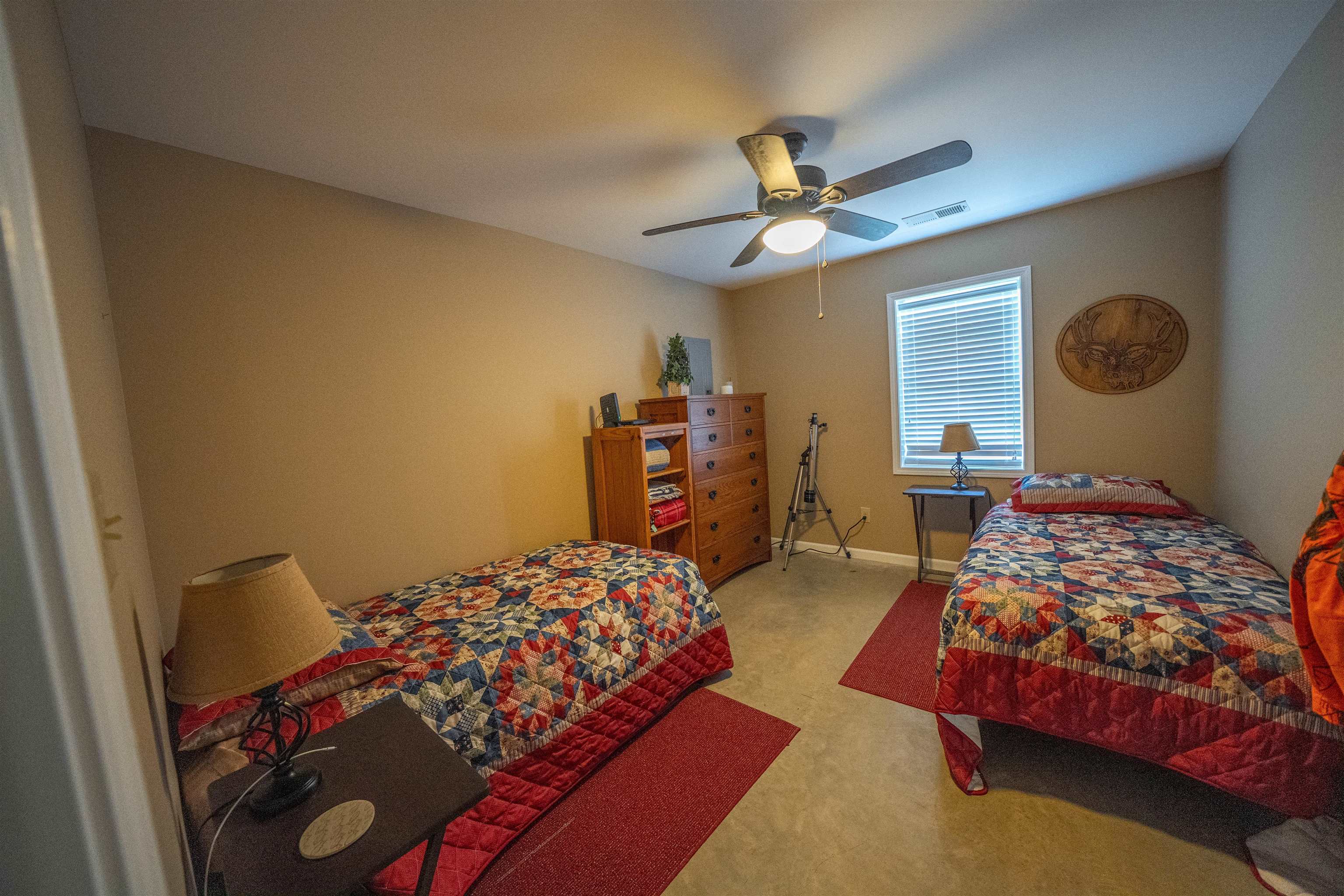 1485 Walton Road Bolivar, TN 38008 - Photo 6 of 23 a bedroom with two beds and a chandelier