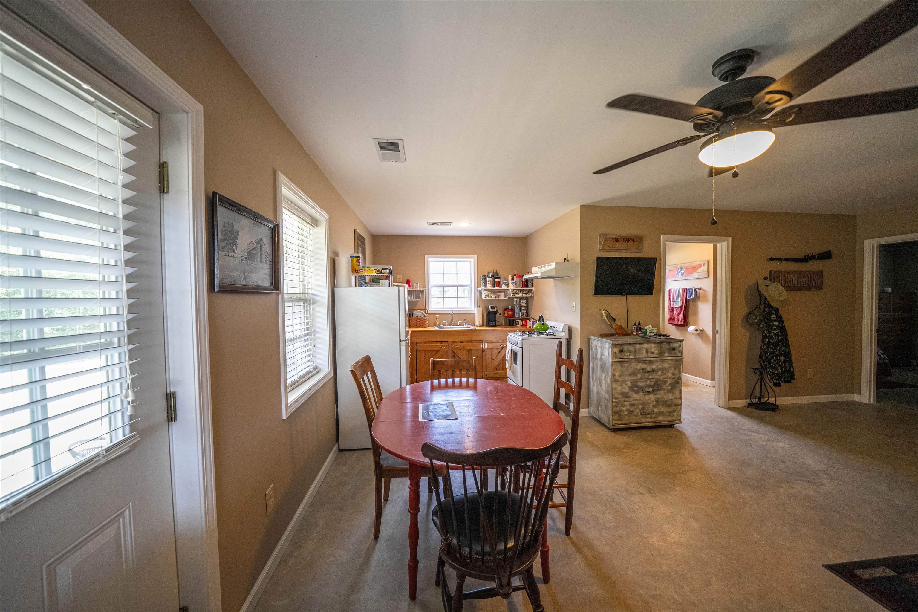 1485 Walton Road Bolivar, TN 38008 - Photo 7 of 23 a view of a dining room with furniture and a window