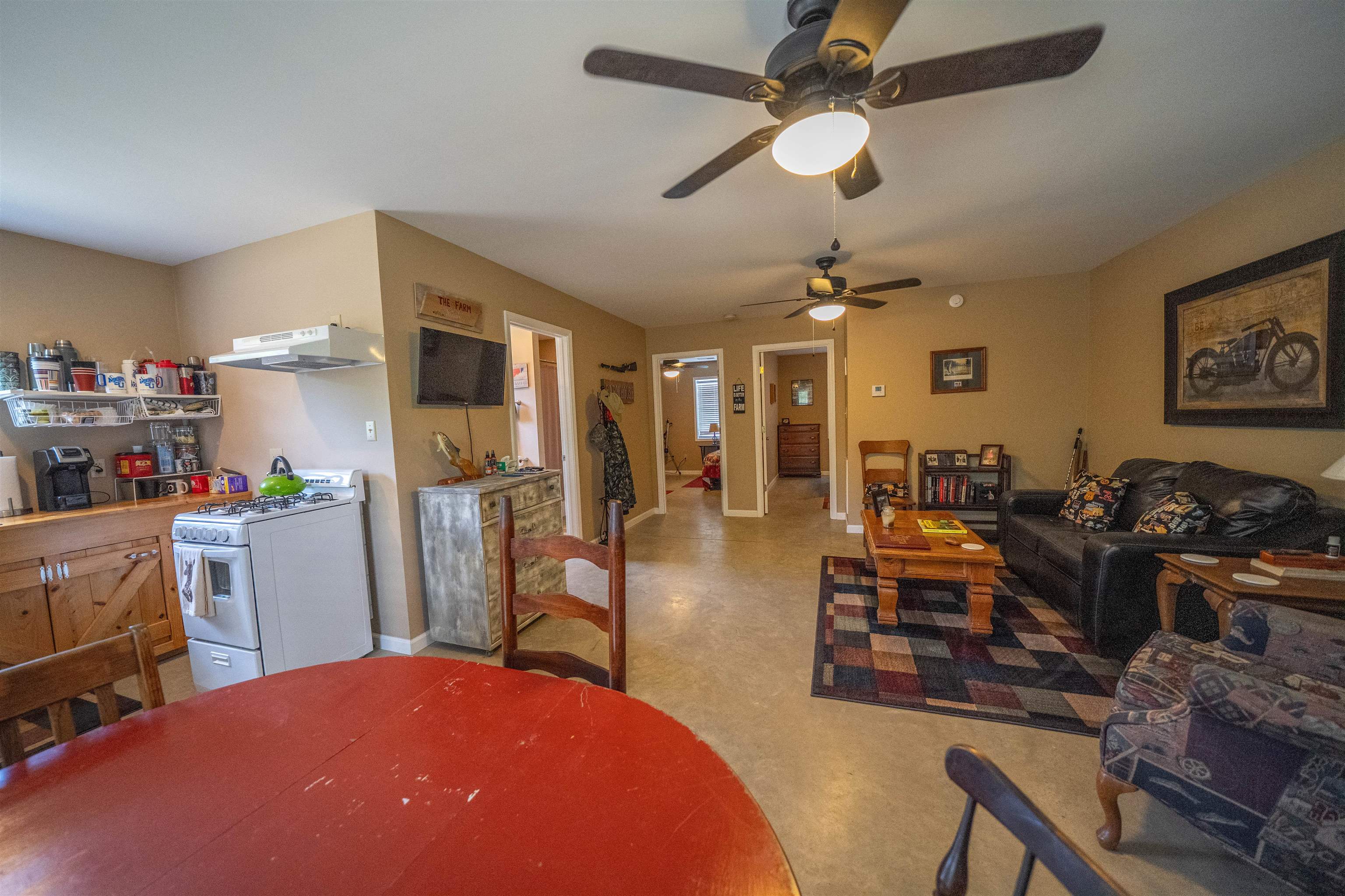 1485 Walton Road Bolivar, TN 38008 - Photo 8 of 23 a living room with furniture a dining table and a fireplace