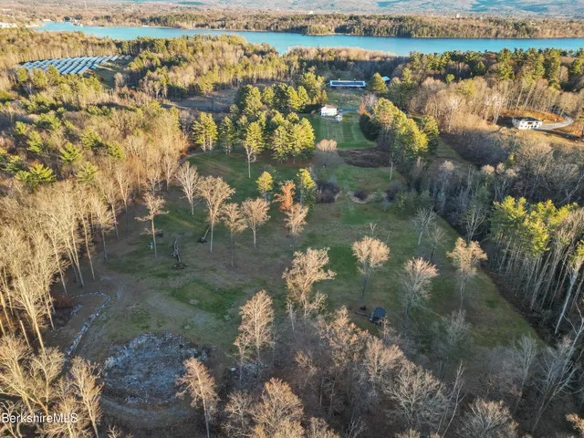a view of lake with a yard