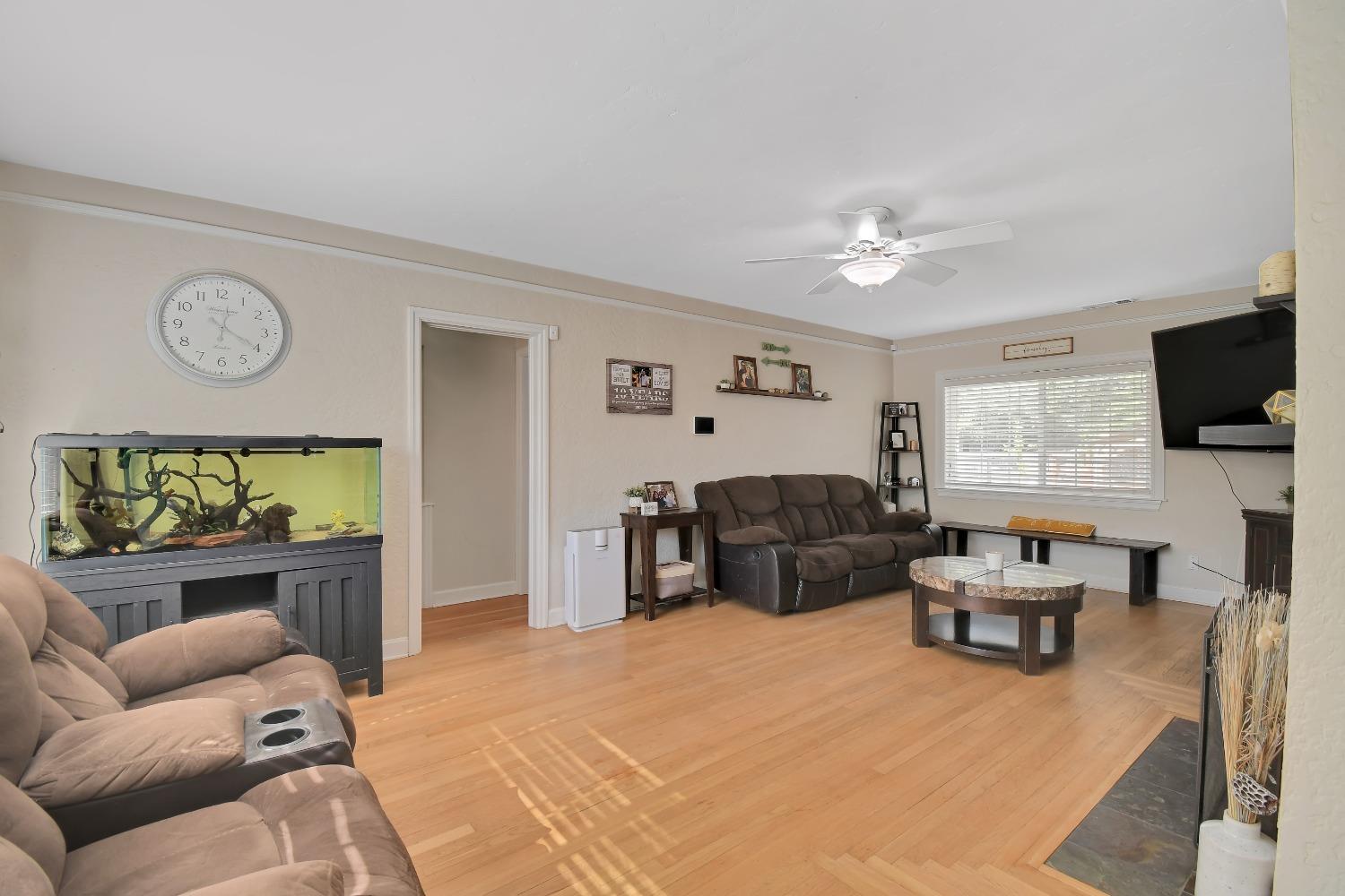 1750 Hazel Street Gridley, CA 95948 - Photo 8 of 20 a bedroom with furniture and a flat screen tv