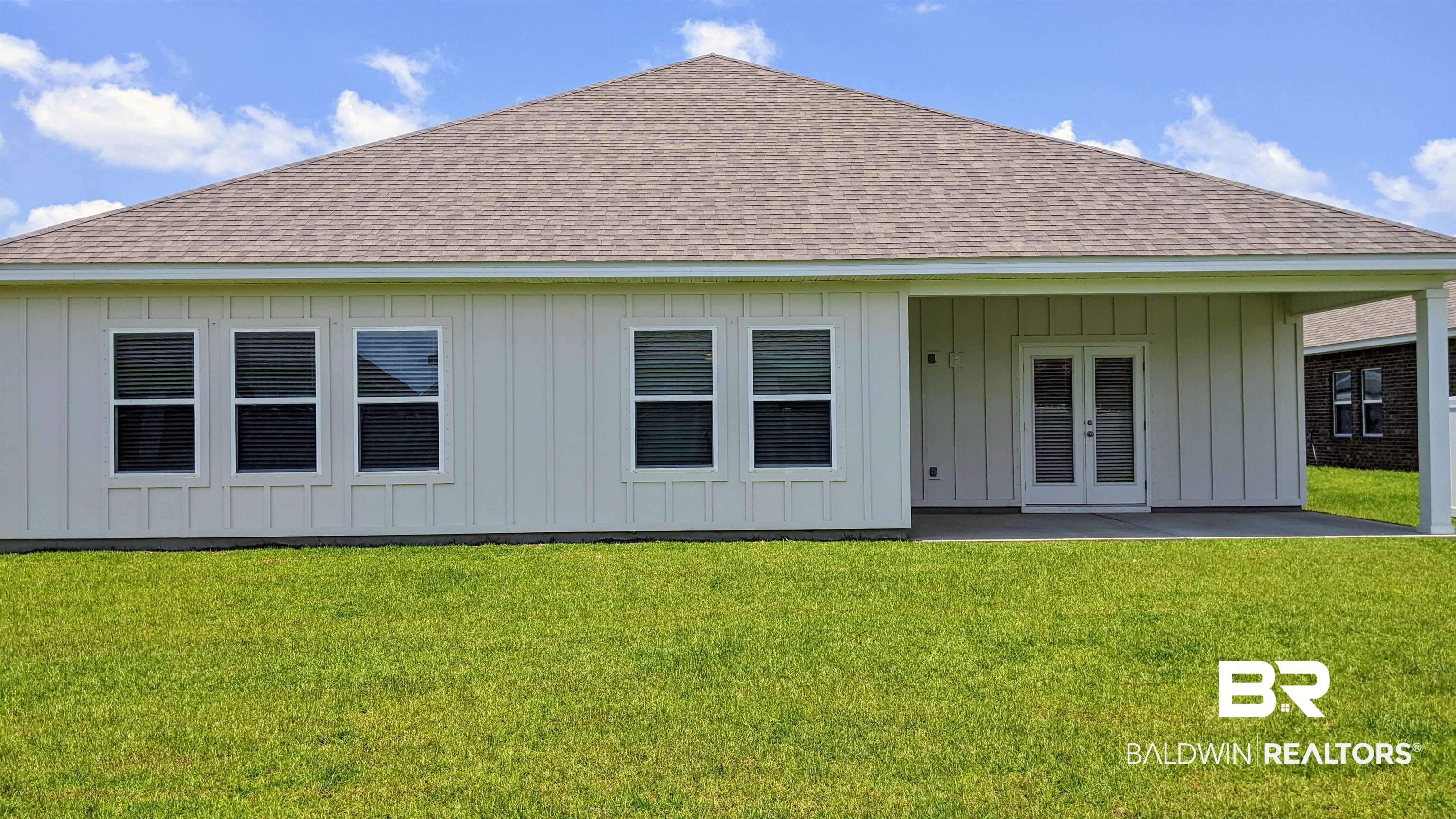11454 Genuine Risk Circle Daphne, AL 36526 - Photo 9 of 20 Rear view of house with a lawn