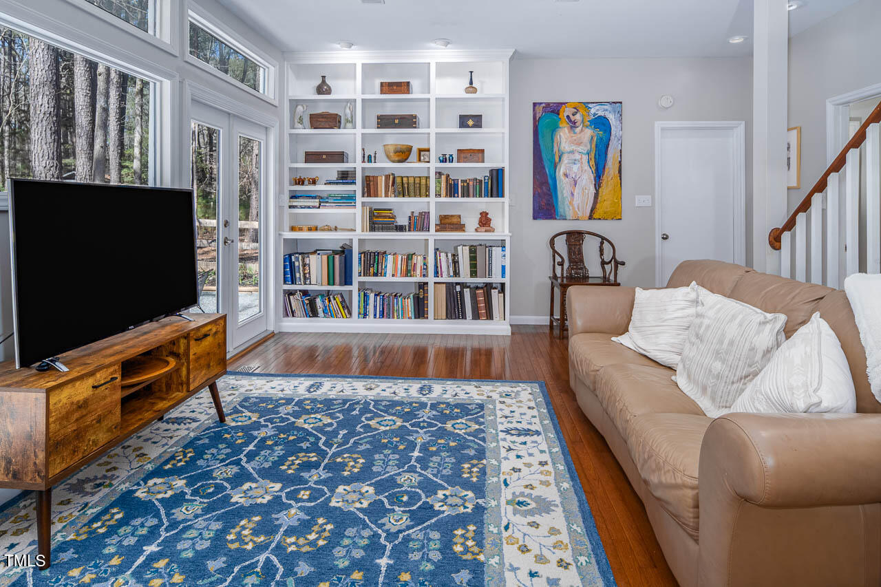 9501 Coachway Chapel Hill, NC 27516 - Photo 14 of 47 a living room with furniture and a flat screen tv