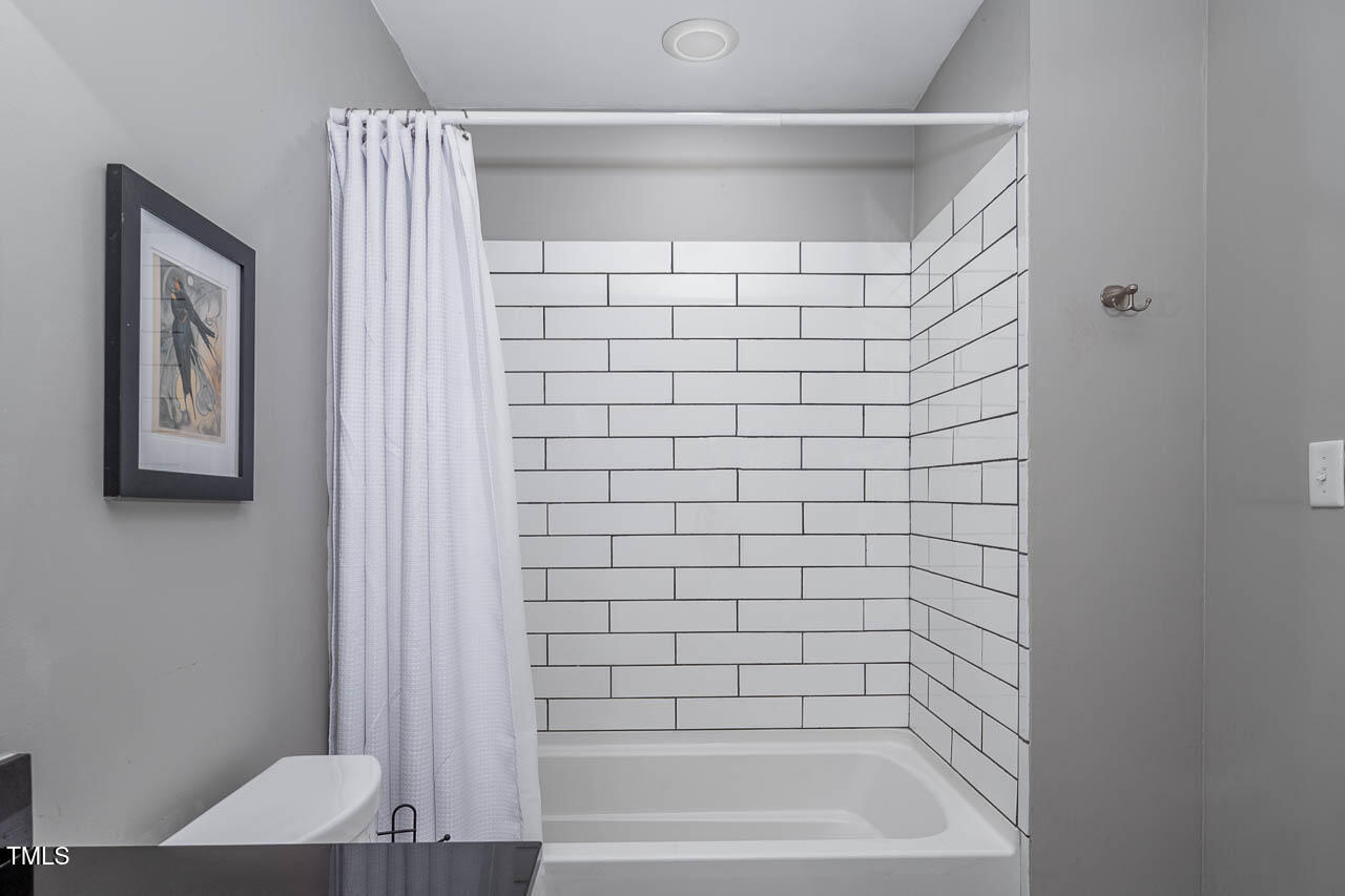 9501 Coachway Chapel Hill, NC 27516 - Photo 18 of 47 a bathroom with a bathtub