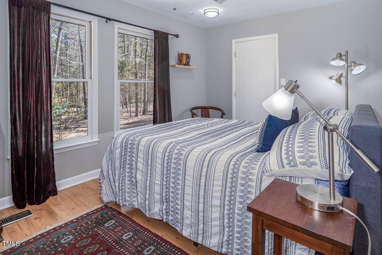 9501 Coachway Chapel Hill, NC 27516 - Photo 23 of 47 a bedroom with a bed and a window