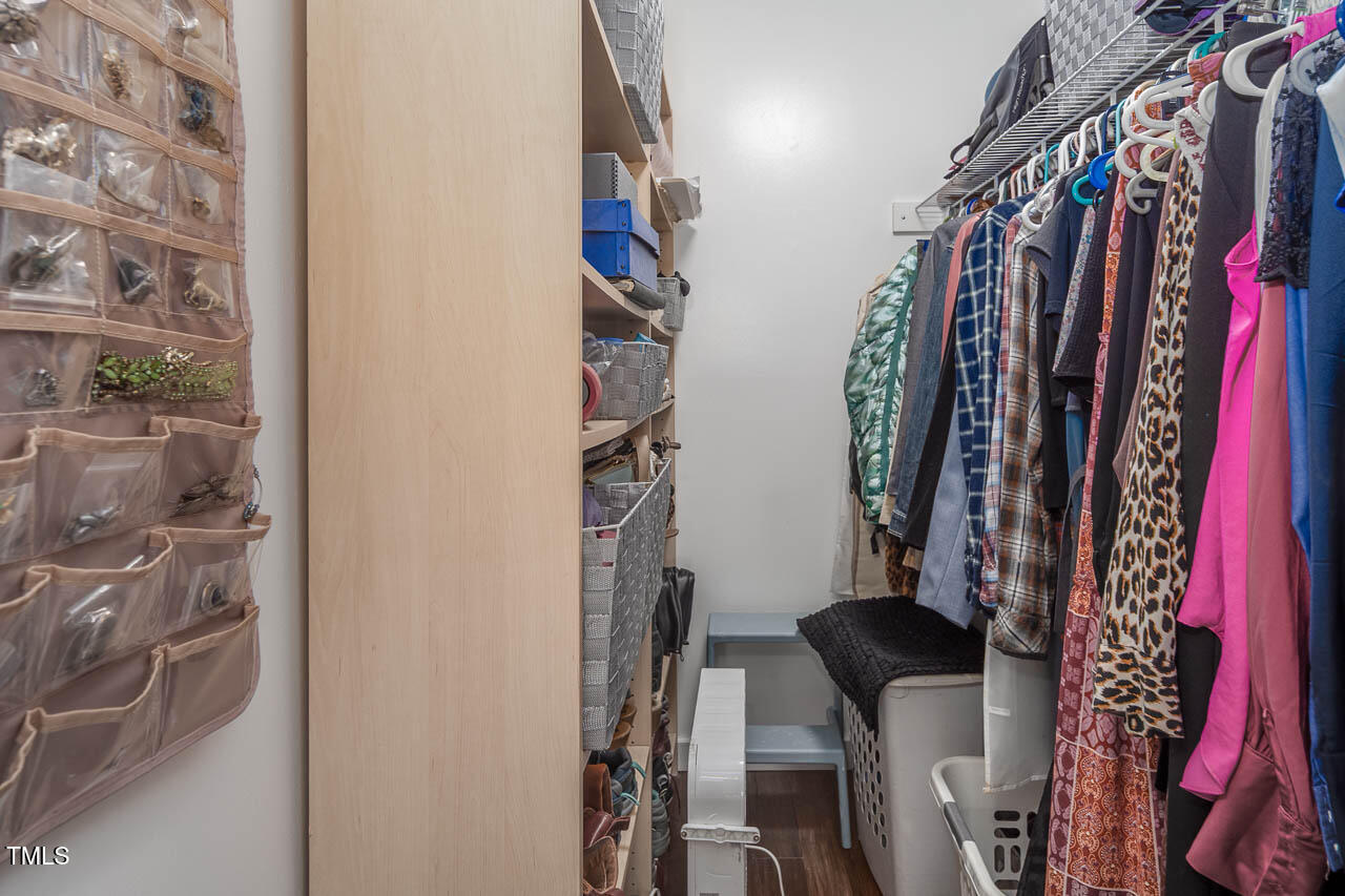 9501 Coachway Chapel Hill, NC 27516 - Photo 27 of 47 a view of walk in closet with clothes and shoes