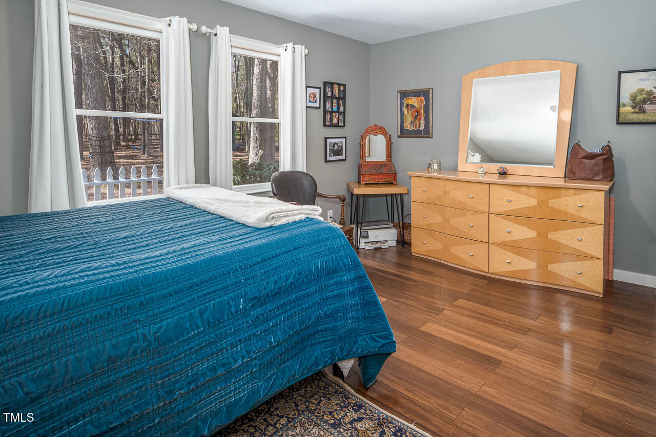 9501 Coachway Chapel Hill, NC 27516 - Photo 28 of 47 a bed room with furniture and a flat screen tv