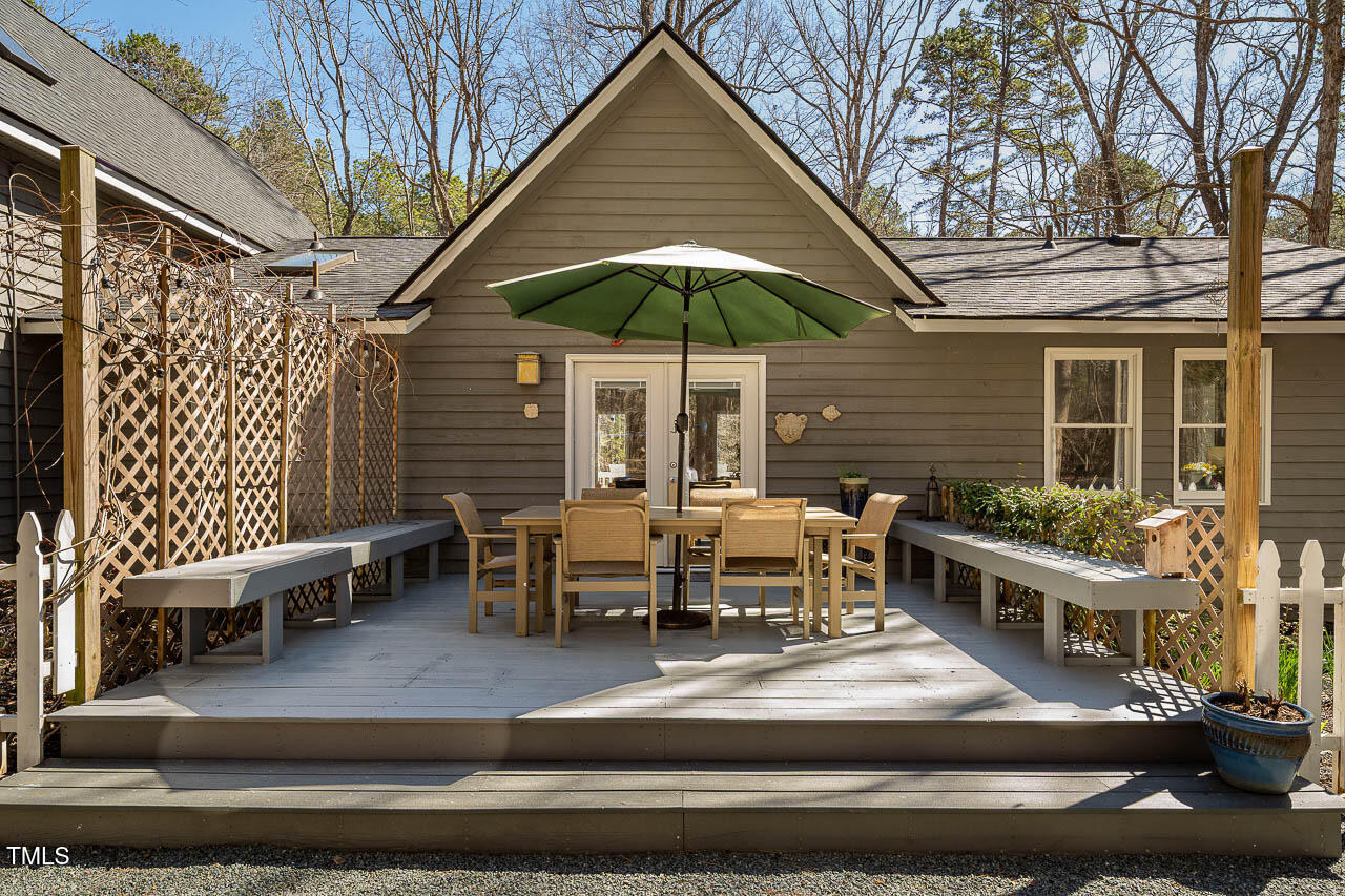 9501 Coachway Chapel Hill, NC 27516 - Photo 2 of 47 a view of house with yard outdoor seating and barbeque oven