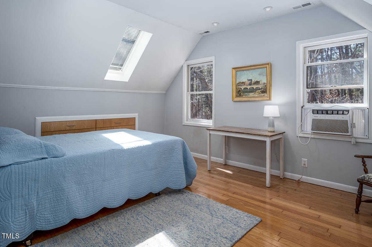 9501 Coachway Chapel Hill, NC 27516 - Photo 30 of 47 a bedroom with a bed and a window