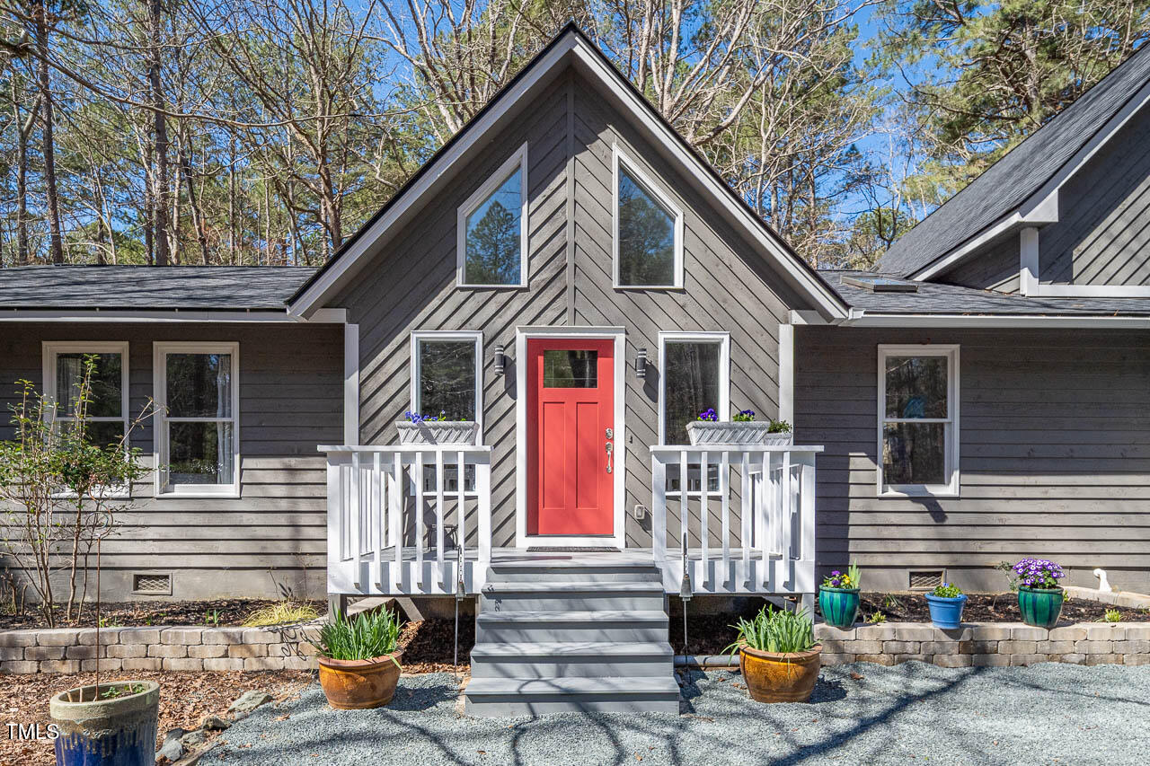 9501 Coachway Chapel Hill, NC 27516 - Photo 37 of 47 a front view of a house with patio