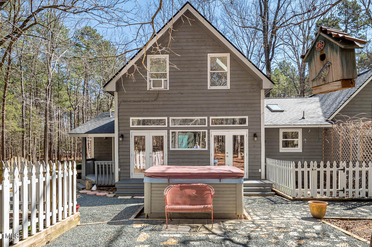9501 Coachway Chapel Hill, NC 27516 - Photo 3 of 47 a front view of a house with a yard