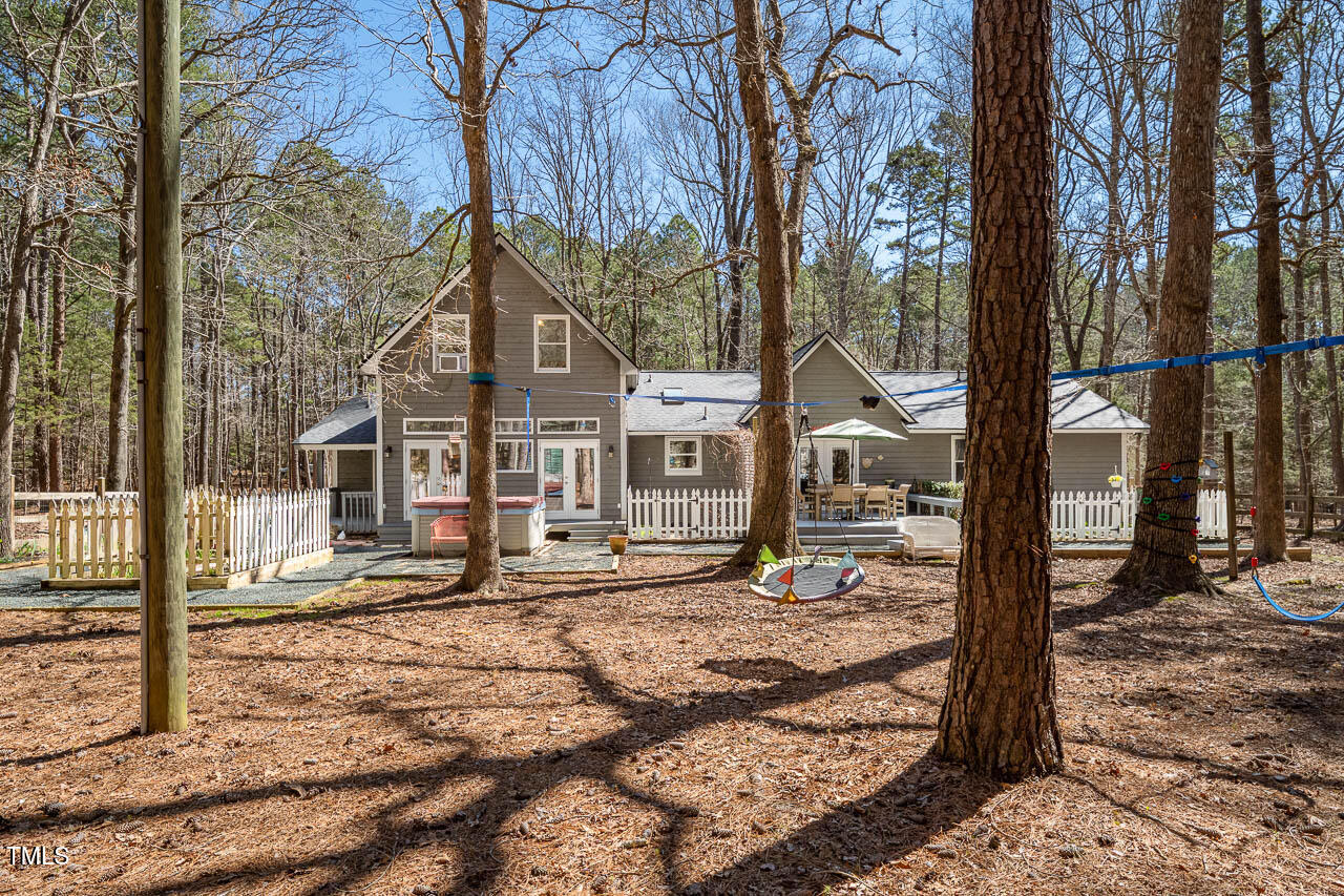 9501 Coachway Chapel Hill, NC 27516 - Photo 40 of 47 a view of a house with a yard covered in snow