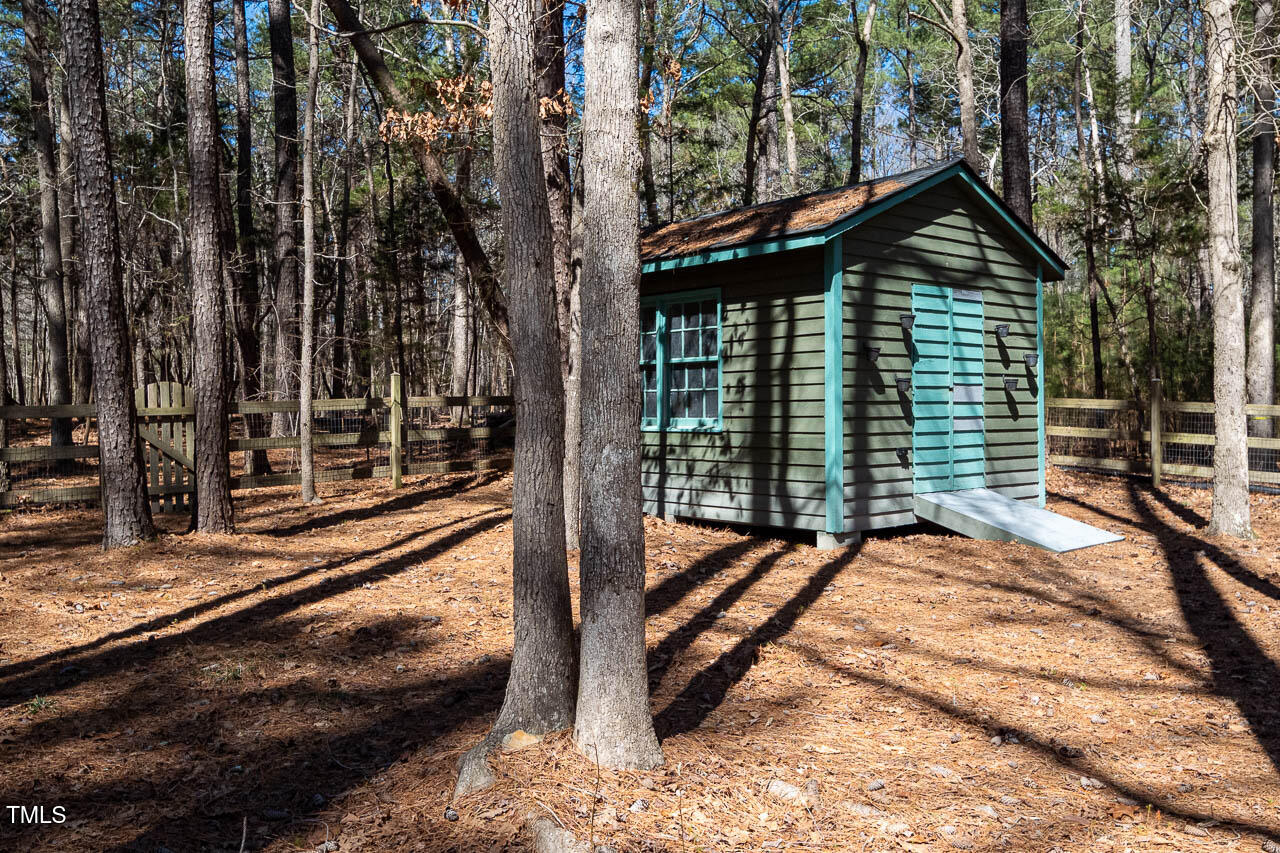 9501 Coachway Chapel Hill, NC 27516 - Photo 42 of 47 a view of a house with backyard and sitting area