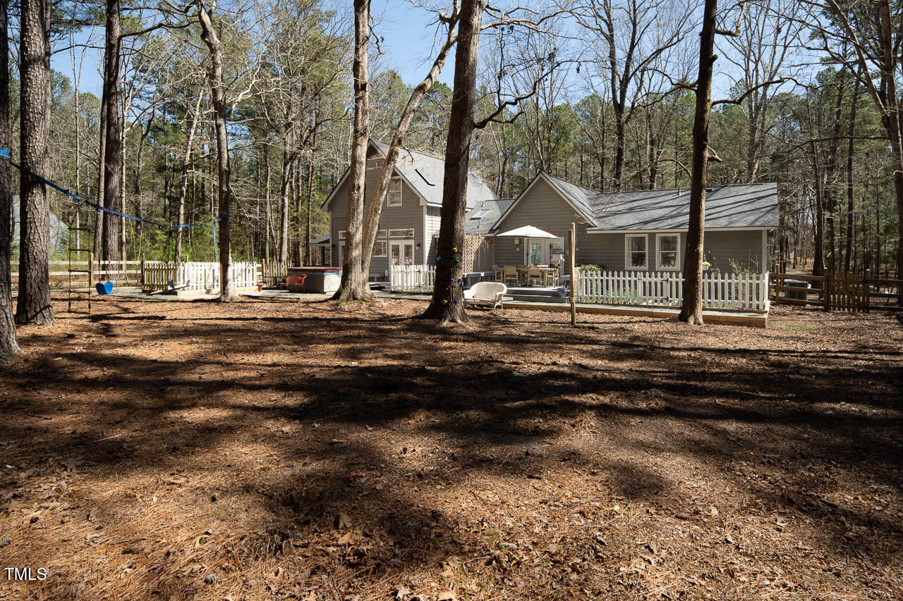 9501 Coachway Chapel Hill, NC 27516 - Photo 44 of 47 a front view of a house with a yard