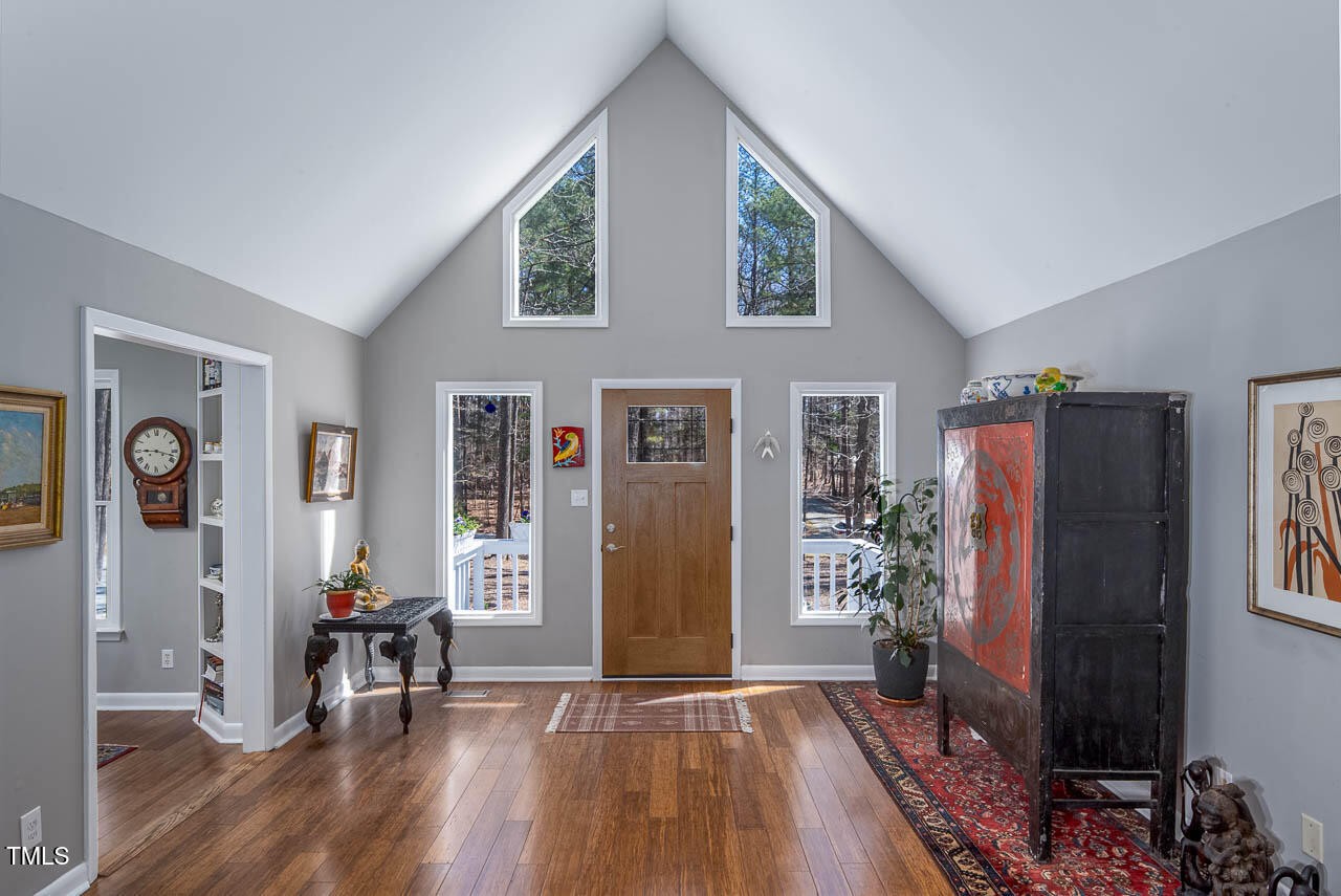 9501 Coachway Chapel Hill, NC 27516 - Photo 4 of 47 a view of livingroom with furniture and wooden floor