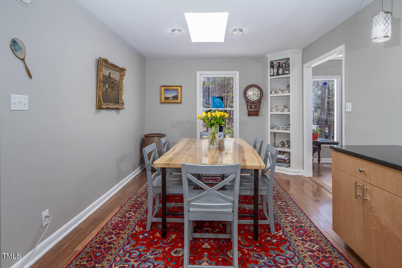 9501 Coachway Chapel Hill, NC 27516 - Photo 8 of 47 a view of a dining room with furniture and wooden floor