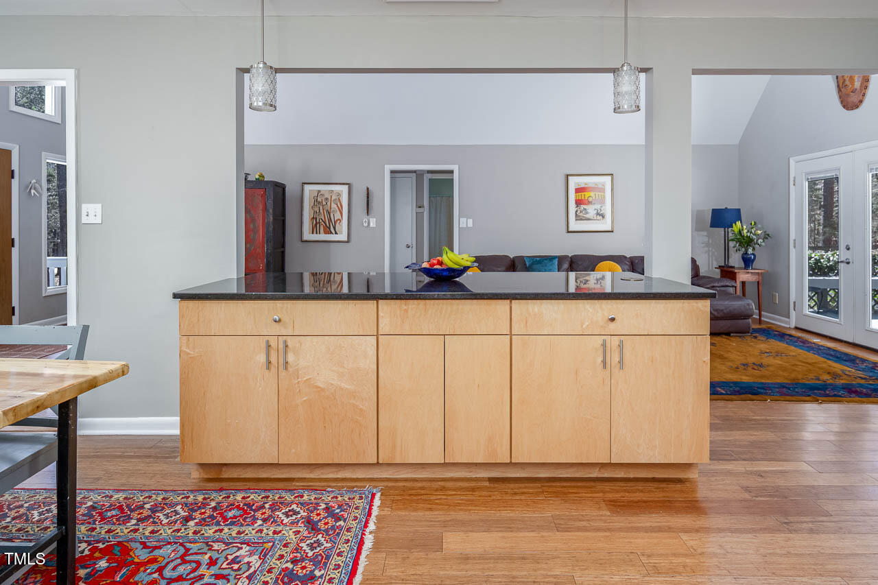 9501 Coachway Chapel Hill, NC 27516 - Photo 9 of 47 a room with furniture a flat screen tv and a table