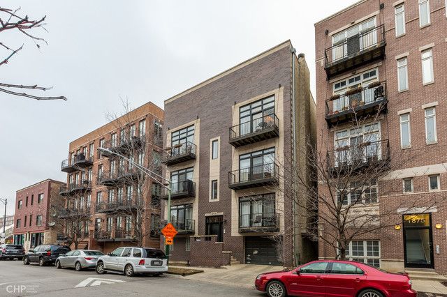a cars parked in front of a building