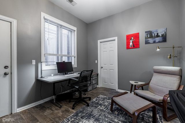 a workspace with furniture and window