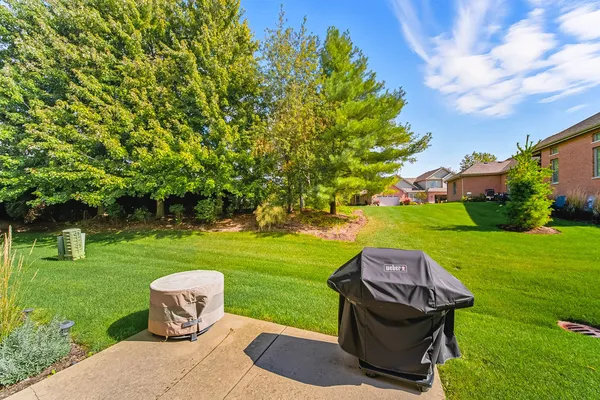 a view of a garden with an outdoor space and seating