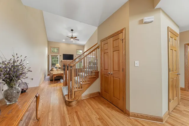 a view of entryway with wooden floor and stairs