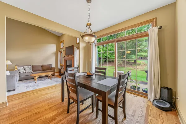 a view of a dining room with furniture window and wooden floor