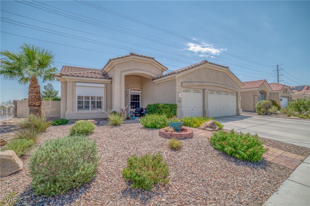 Restricted Address Las Vegas, NV 89145 - Photo 1 of 25 Mediterranean / spanish home with a garage, stucco