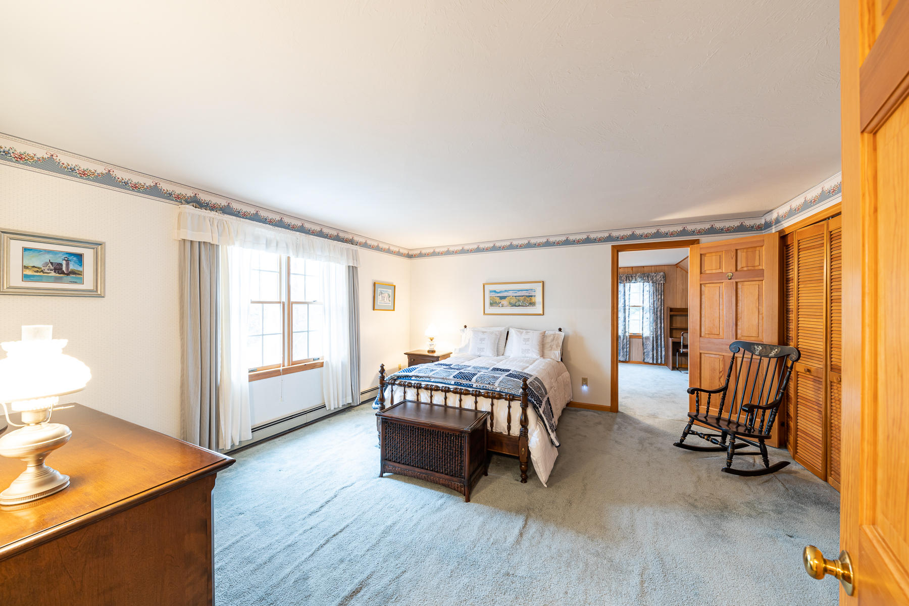 123 Camelback Road Marstons Mills, MA 02648 - Photo 17 of 30 a bedroom with a bed and wooden floor