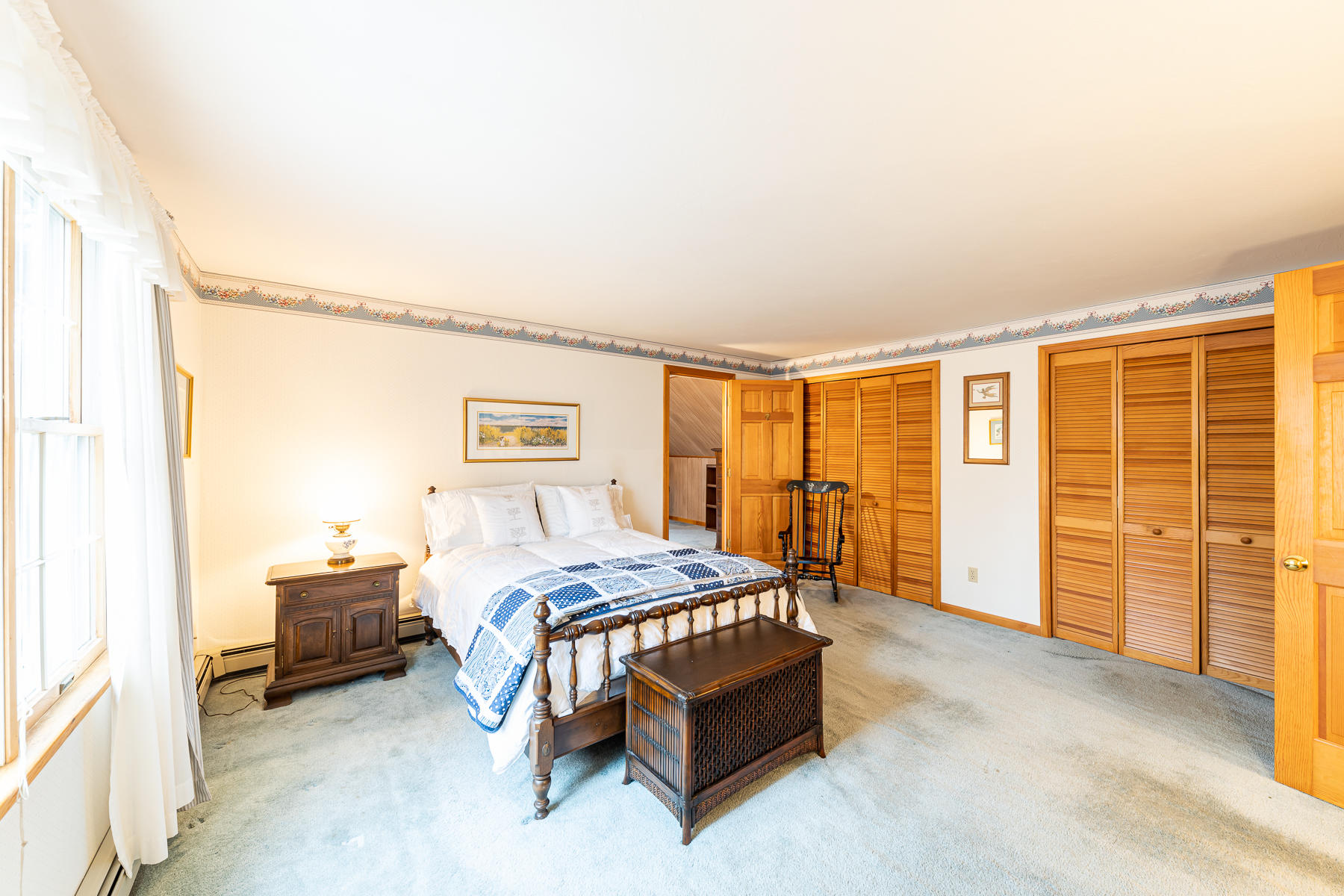 123 Camelback Road Marstons Mills, MA 02648 - Photo 18 of 30 a bed room with a bed and a chair