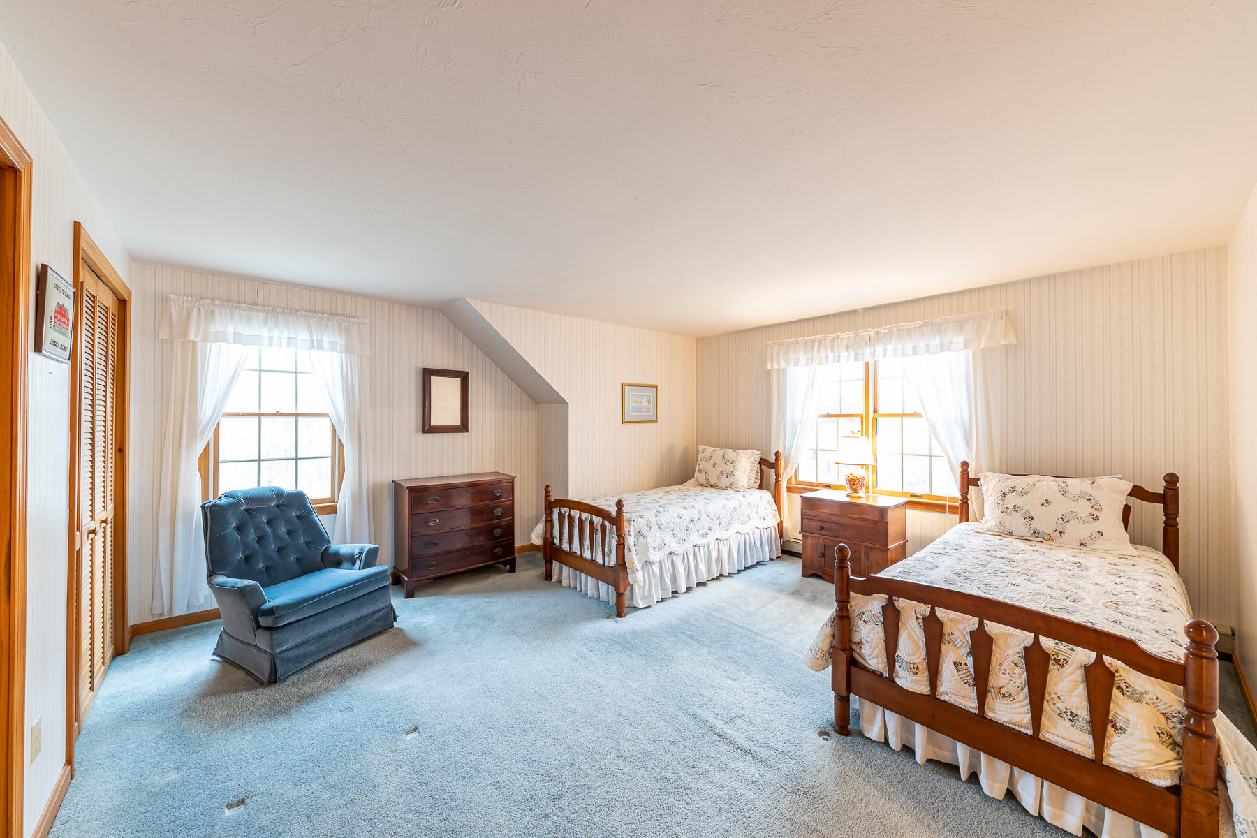 123 Camelback Road Marstons Mills, MA 02648 - Photo 23 of 30 a bedroom with furniture and a fireplace