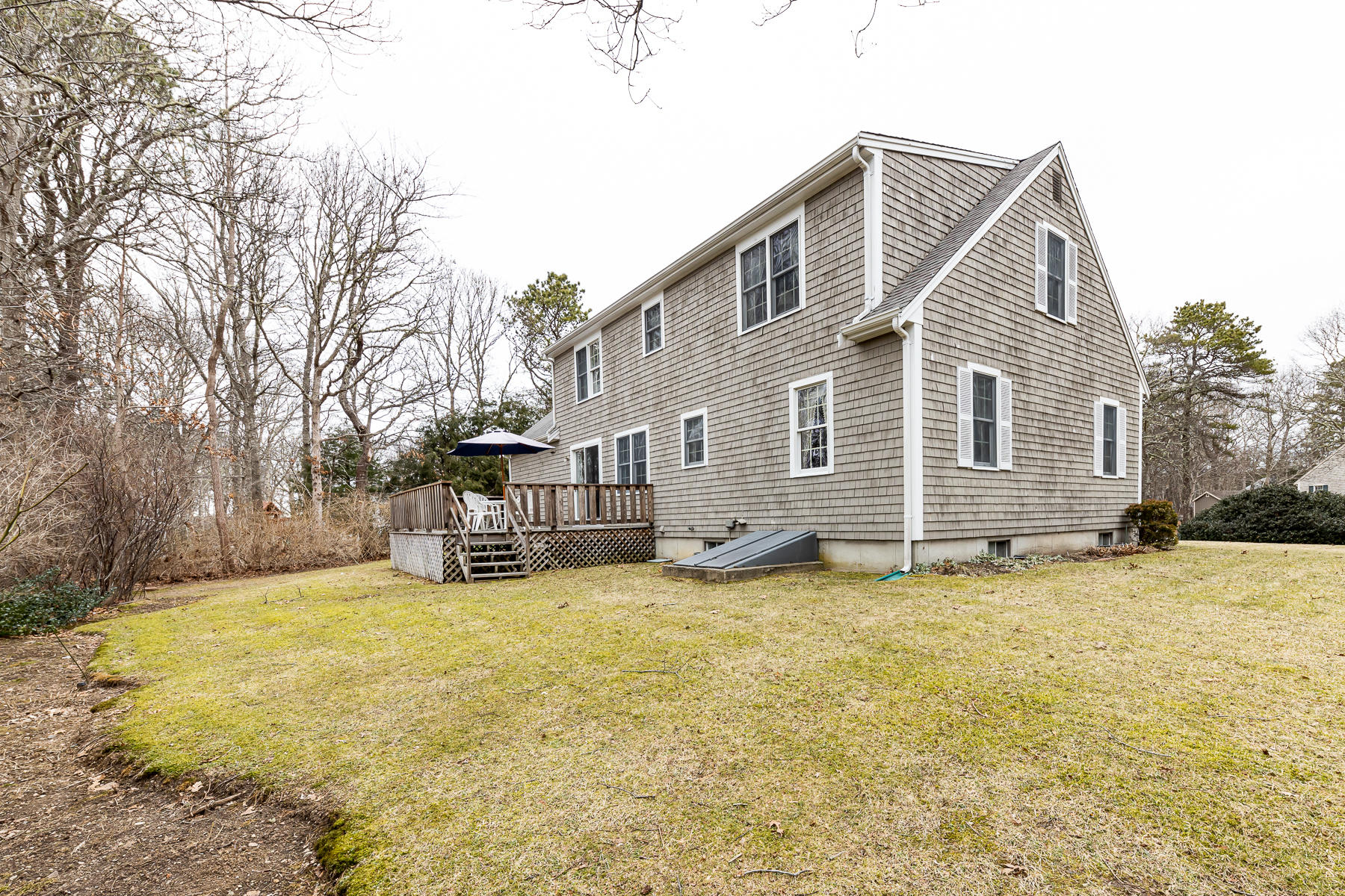 123 Camelback Road Marstons Mills, MA 02648 - Photo 25 of 30 a view of a house with a big yard and large tree