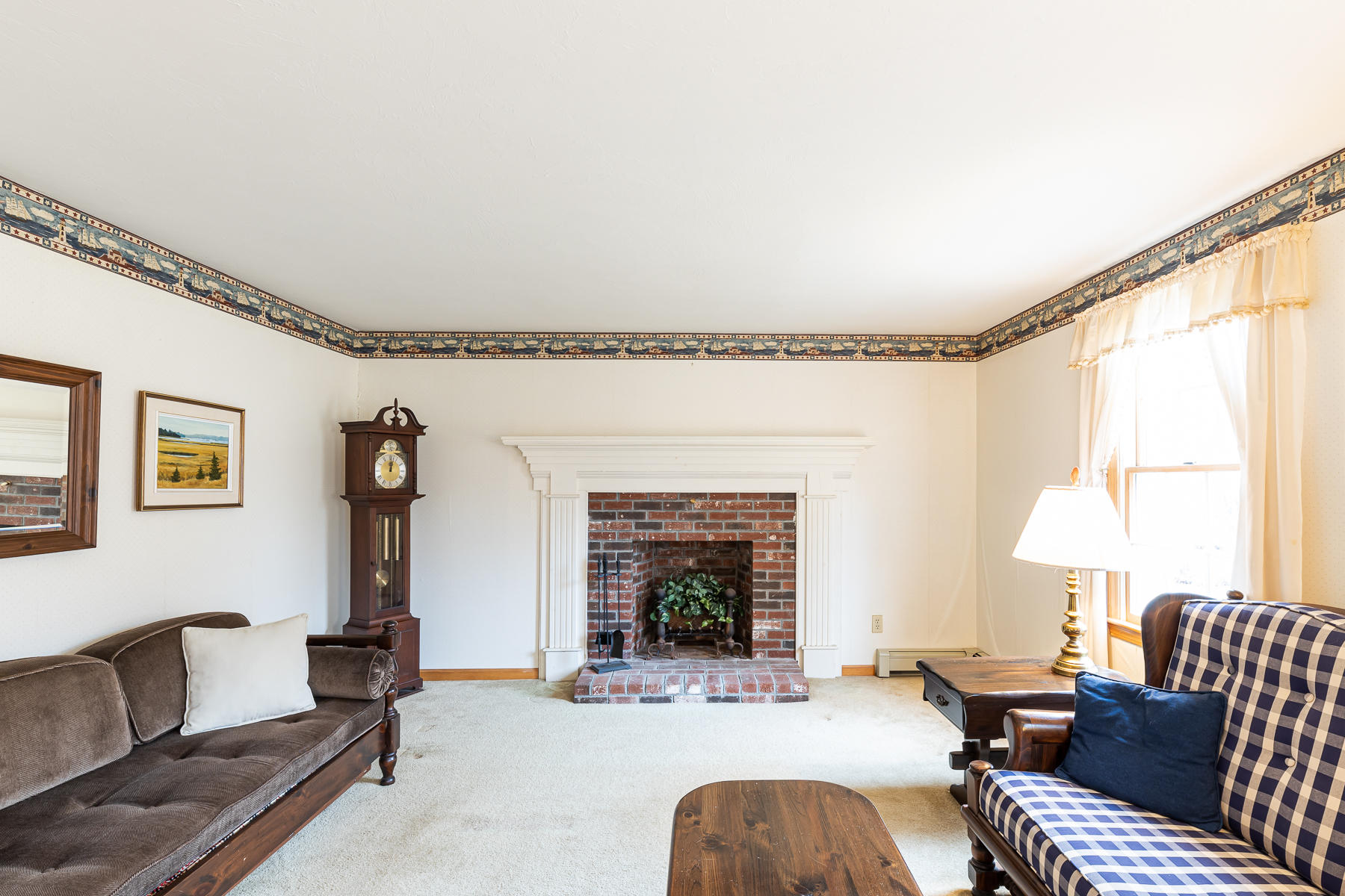 123 Camelback Road Marstons Mills, MA 02648 - Photo 5 of 30 a living room with furniture and a fireplace