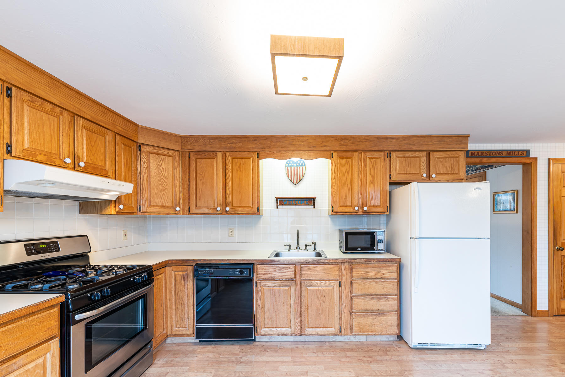 123 Camelback Road Marstons Mills, MA 02648 - Photo 8 of 30 a kitchen with granite countertop a refrigerator stove top oven and sink