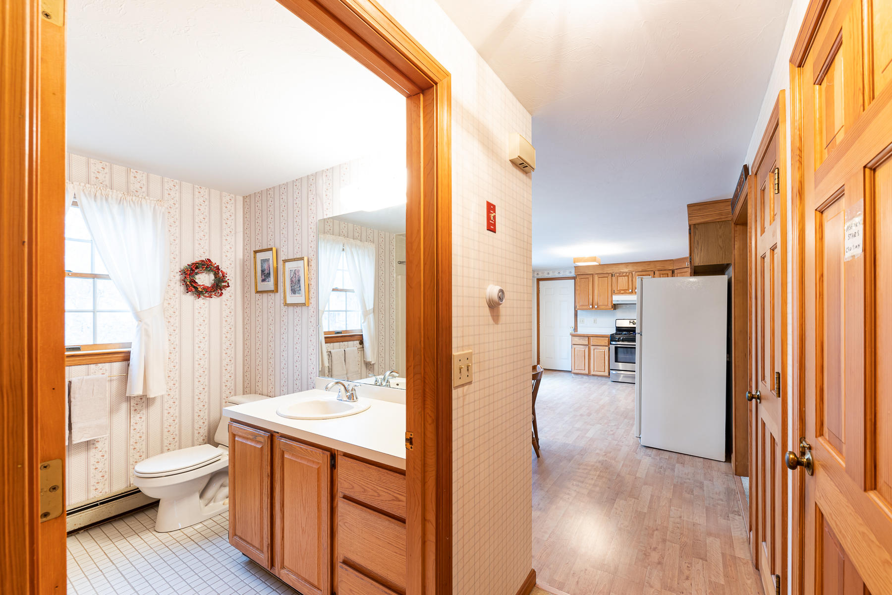 123 Camelback Road Marstons Mills, MA 02648 - Photo 9 of 30 a bathroom with a sink a toilet and a large mirror